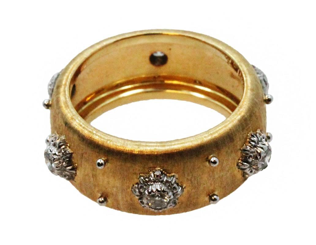 18K Yellow Gold Buccellati Macri Band Ring With 6 Round Brilliant Cut Diamonds Weighing 0.24ct. This Ring is a Size 6.