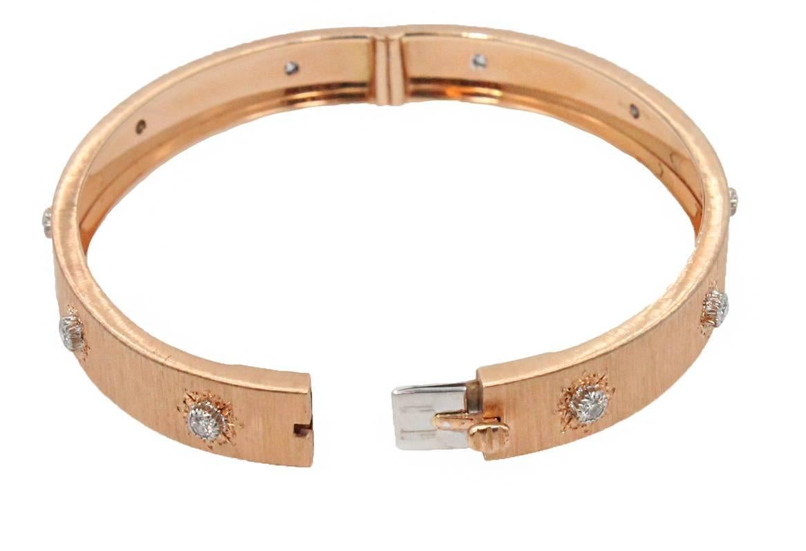 18K Rose Gold Buccellati Classica Bangle With 10 Round Brilliant Diamonds Surrounding The Band Weighing 0.49ct. This Bangle Fits a Size 6 Wrist.
