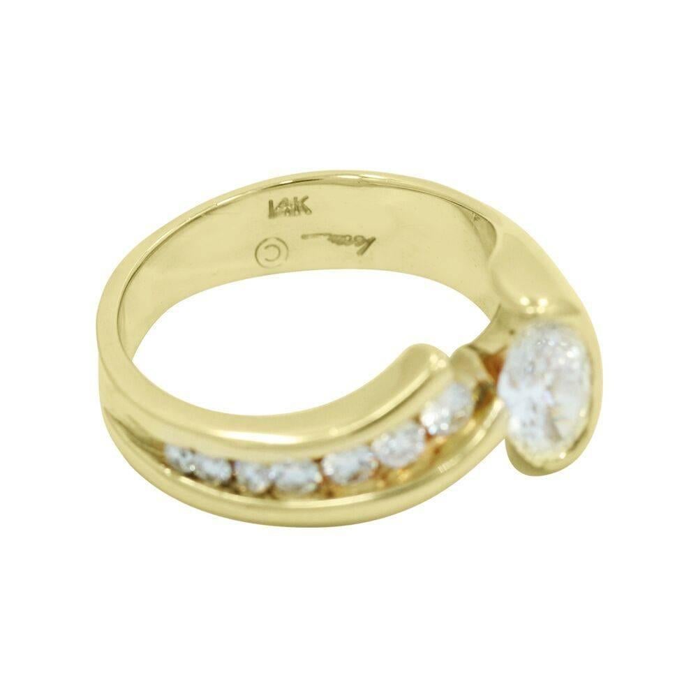 Up for sale is this beautiful 14k yellow gold G/VS oval diamond ring. The oval diamond is approximately 0.85 carats with seven (7) channel set diamonds weighing approximately .35 carats total weight. Ring sits at a size 7.5 and can be easily