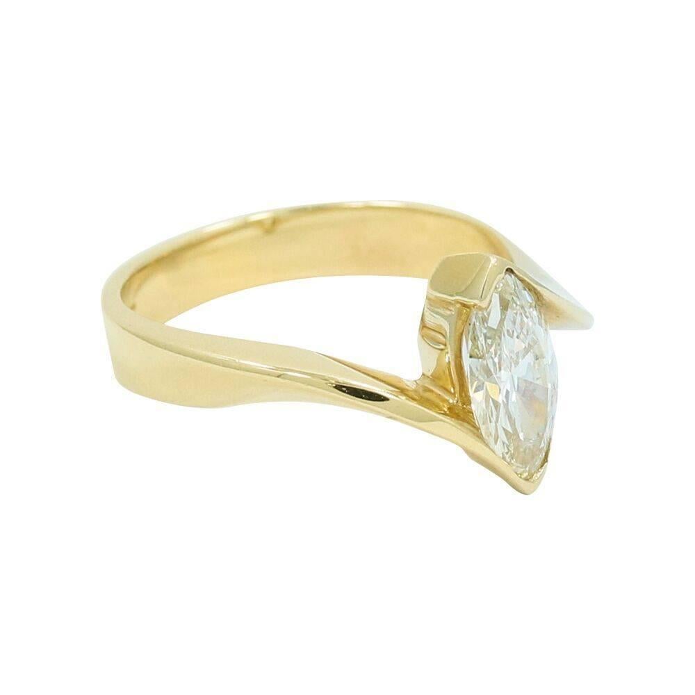 Up for sale is this 14k yellow gold marquise diamond ring. The marquise diamond weighs approximately 1.00 carat total weight. Ring sits at a size 7 and can be easily sized. It measures just a little under an inch in height, and weighs a total of 4.6