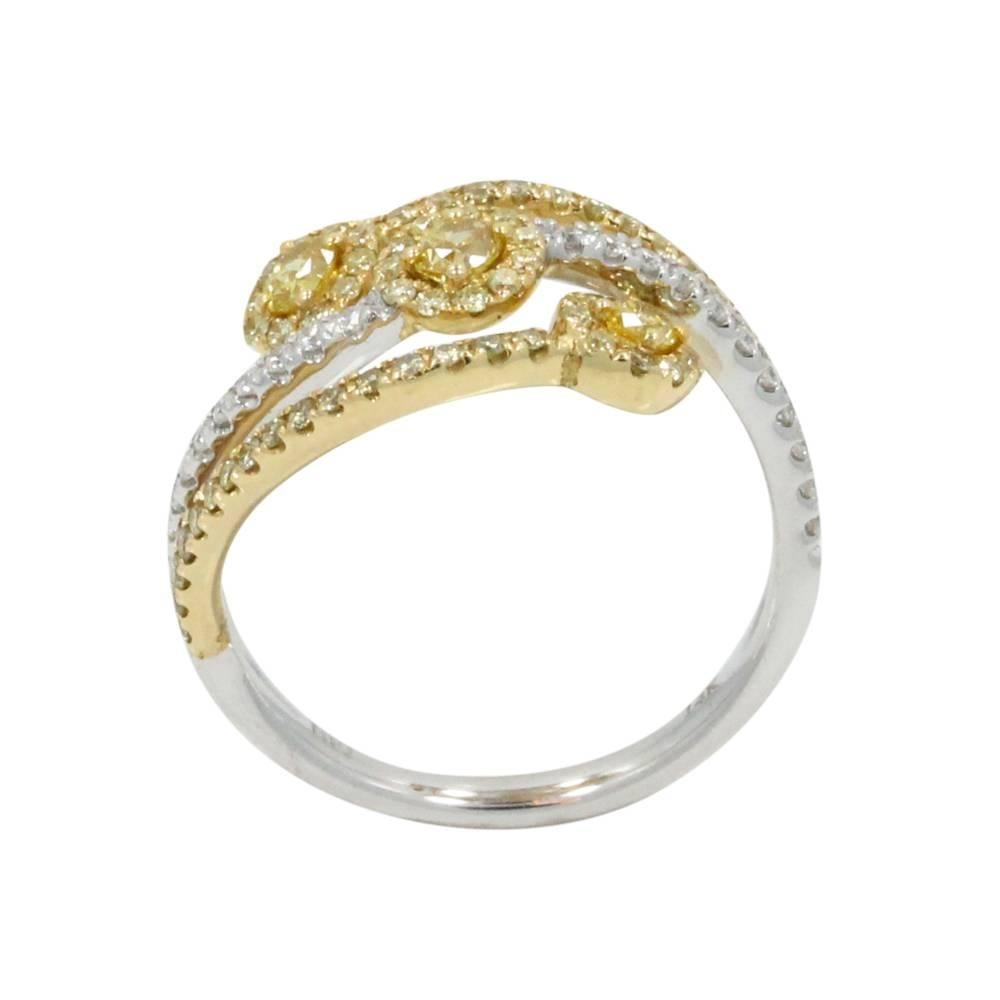 14K White and Yellow Gold Ring With 3 Fancy Yellow Diamonds at a Total Carat Weight of .32ct and White Diamonds With a Total Carat Weight of 0.13ct and Yellow Diamonds With a Total Carat Weight of 0.32ct. This Ring is a Size 6.