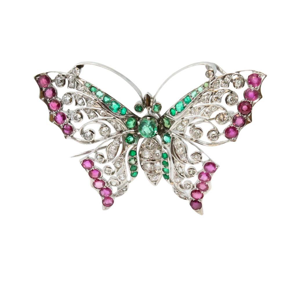 18K White Gold Butterfly Pin With Diamonds Weighing A Total Carat Weight Of 2.25 ct and Rubies Weighing A Total Carat Weight 3.50 ct and Emeralds With a Total Carat Weight of 1.25 ct. 