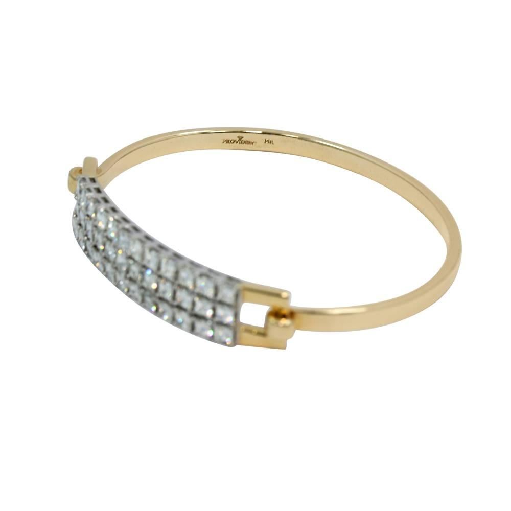 Up for sale is this 14k white and yellow gold asscher cut diamond bangle bracelet. It has 36 diamonds G,VS weighing approximately 7.20 carats total weight. The bracelet measures 2.75" in width x 2.25" in height with a total weight of 26.7