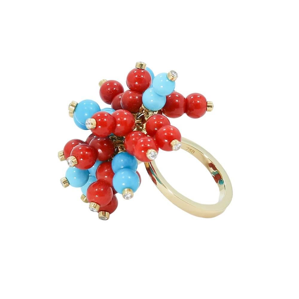 Up for sale is this 18k yellow gold turquoise and coral beaded ring. The diamonds weigh approximately .46 carats total weight. Ring sits at a size 6.25 and can be easily sized. It weighs a total of 22.0 grams. The ring is in great condition. It is
