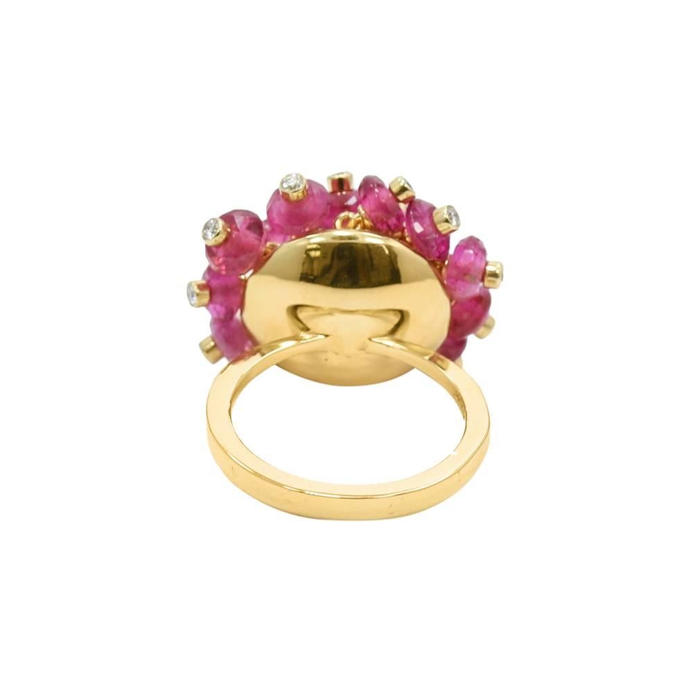 Up for sale is this 18k yellow gold rubelite and diamond beaded ring. The diamonds weigh approximately 42.00 carats total weight. Ring sits at a size 6.75 and can be easily sized. It weighs a total of 13.6 grams. The ring is in great condition. It