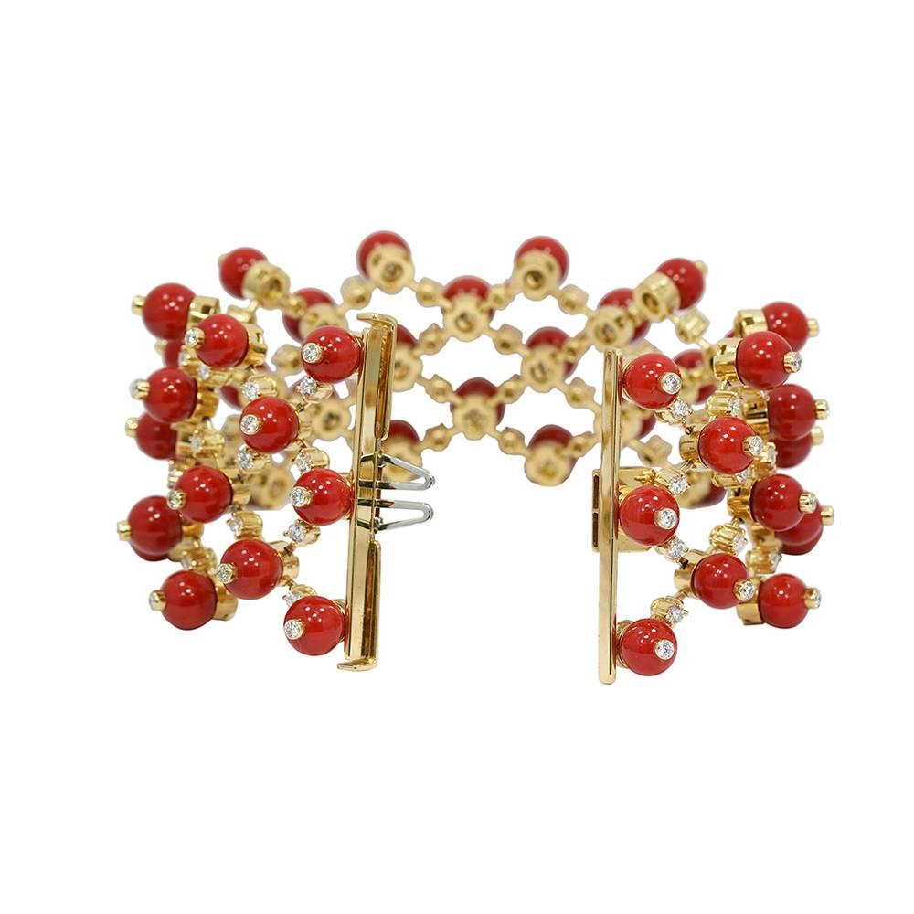 Up for sale is this beautiful 18k yellow gold mediterranean coral and diamond fence beaded bracelet. The diamonds weigh approximately 6.00 carats total weight. The bracelet measures 8.0" in length x 1.5" in width with a total weight of
