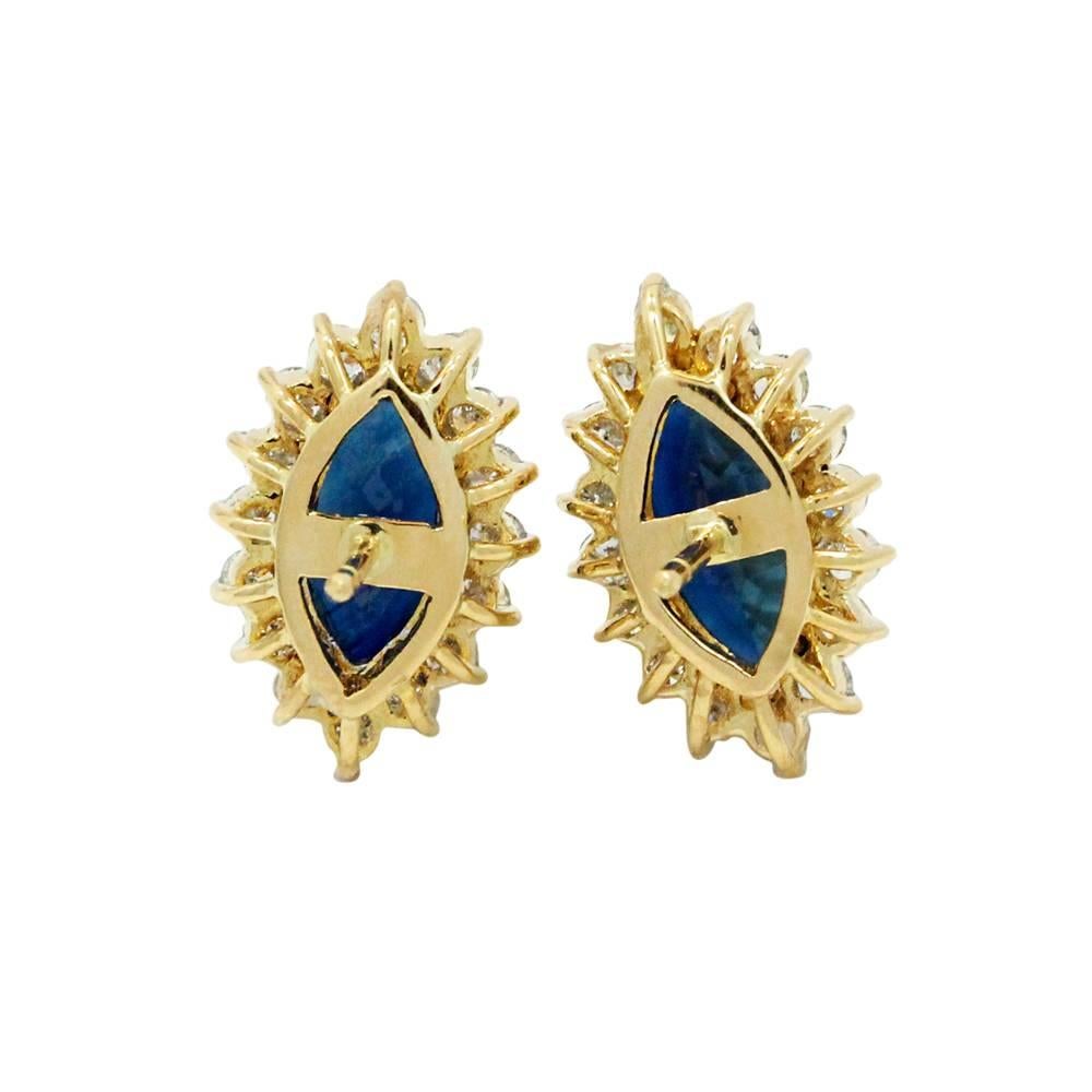18K Yellow Gold Earrings With 2 Blue Sapphires Weighting A Total Carat Weight Of 5.00ct And 32 Surrounding Diamonds I-J In Color And SI In Clarity Weighing A Total Carat Weight Of 1.28ct 
