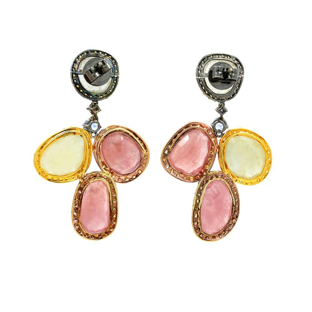 18K Tri Colored Earrings With Pink And Yellow Sapphires Weighing A Total Carat Weight Of 42.69 And Surrounding Diamonds With A Total Carat Weight Of 3.62ct.