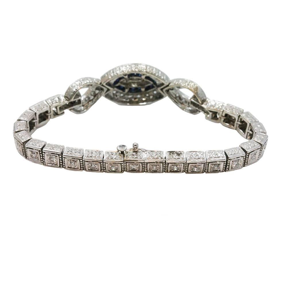 14K White Gold Bracelet With Sapphires Weighing A Total Carat Weight Of 1.38ct And Surrounding Diamonds Weighing A Total Carat Weight Of 3.75ct G-H In Color And VS2-SI1 In Clarity.