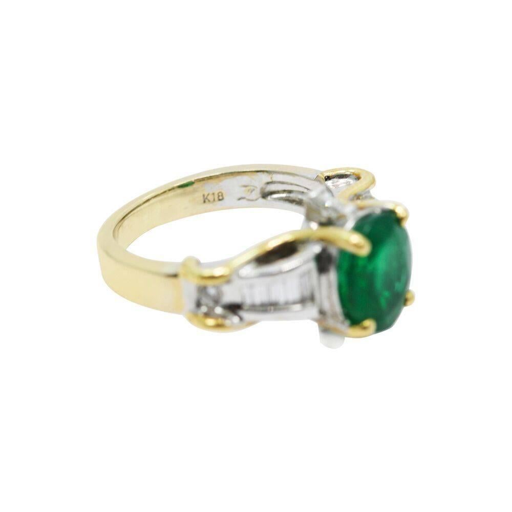 Up for sale is 18K two tone oval emerald and diamond ring. The emerald weighs approximately 2.65 carats total weight and the diamond weighing approximately .20 carats total weight. The ring is a size 5 and weighs a total of 6.1 grams. The ring is in