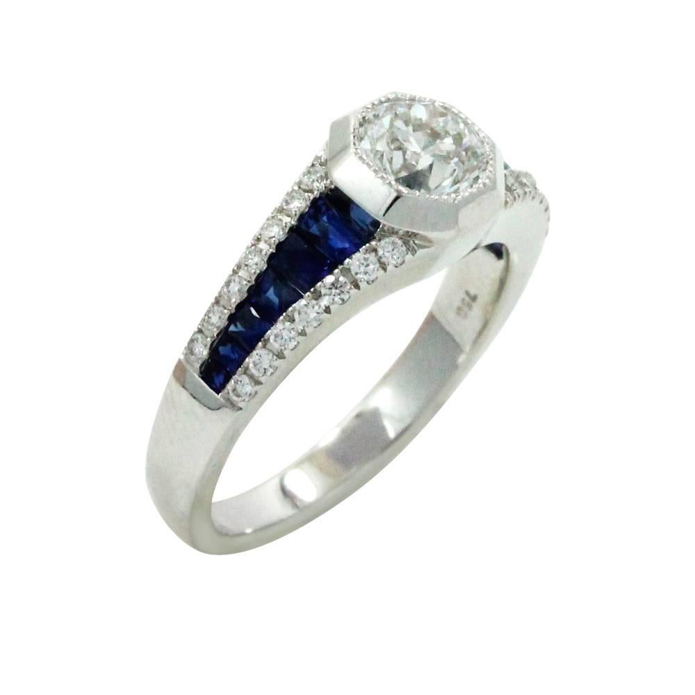 18K White Gold Ring With Sapphires Weighing A Total Carat Weight Of .96ct And Diamonds Weighing A Total Carat Weight Of 0.23ct. This Ring Is A Size 6.5.