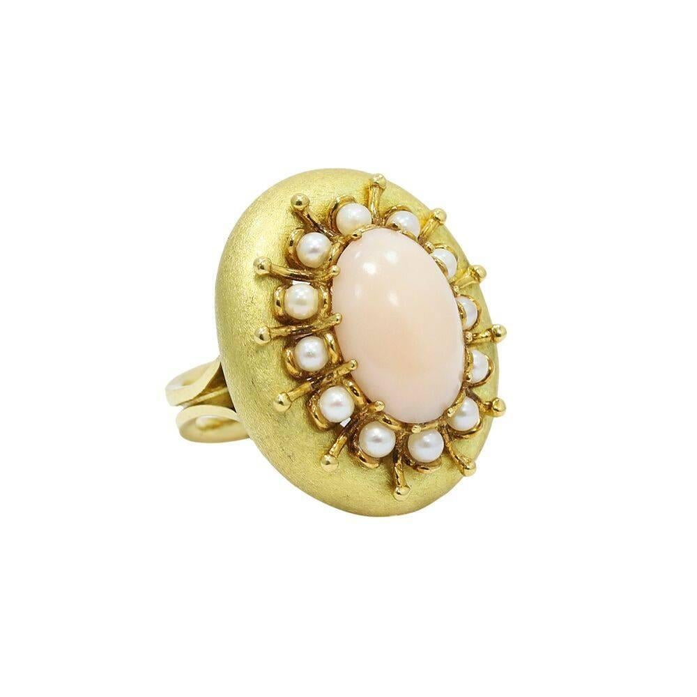 Up for sale is 18K yellow gold angel skin coral and pear ring. It measures 1.25" in height and weighs a total of 17.2 grams. The ring sits at a size 5.25 and is in good condition. Please see all pictures and ask any questions you may have. 