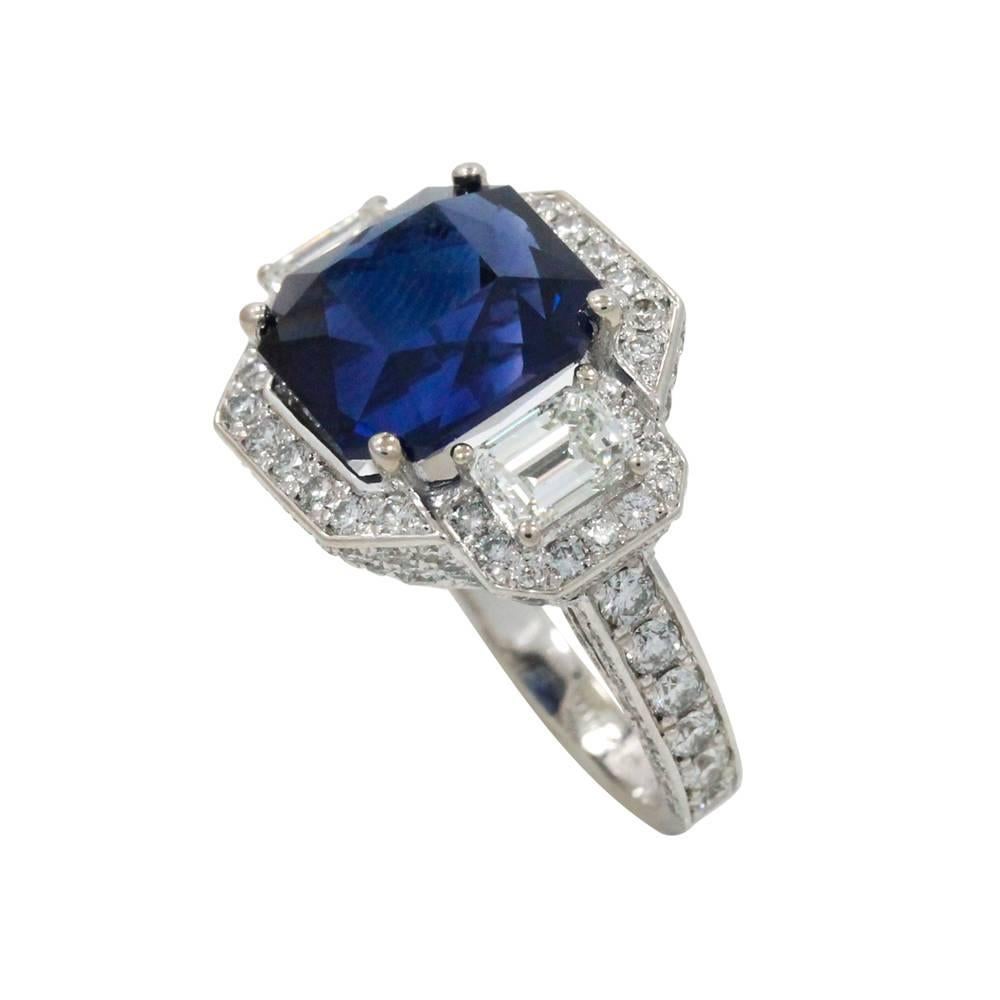 18K White Gold Ring With Center Sapphire Stone Weighing A Total Carat Weight Of 9.70ct And Diamonds Weighing A Total Carat Weight Of 4.99ct. This Ring Is A Size 7.