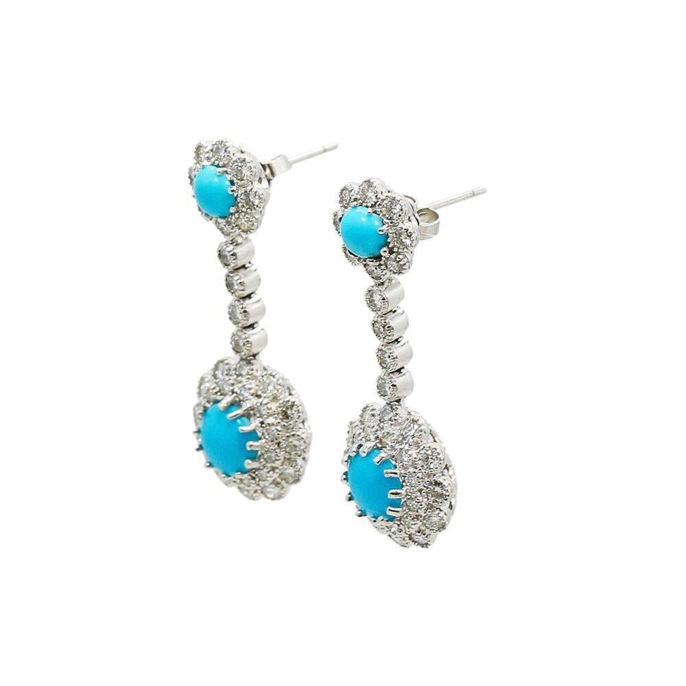 We have these beautiful 18k white gold turquoise and diamond dangle earrings for sale with seventy two (72) diamonds weighing approximately 1.00 carats total weight. They measure 1.375" in height and weigh a total of 8.4 grams. These earrings