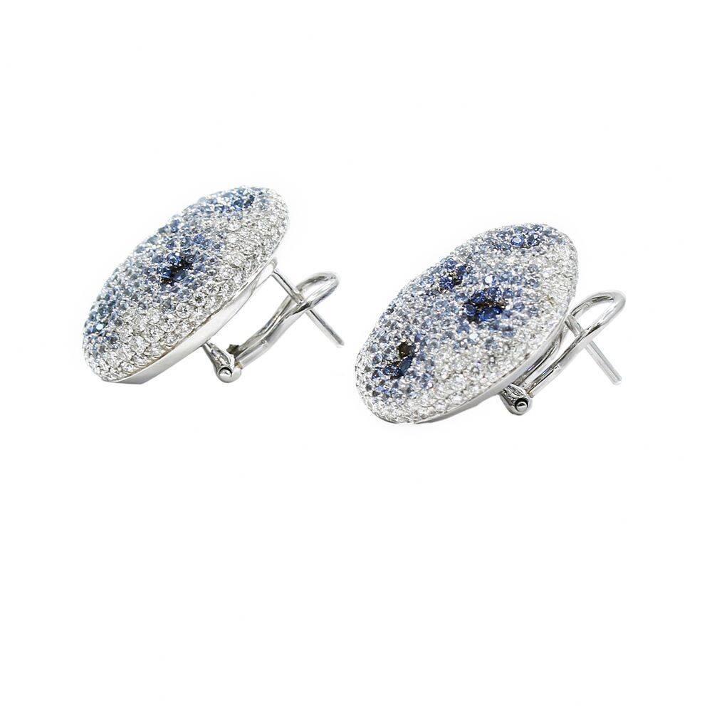 We have these beautiful 18k white gold sapphire and diamond Palmiero earrings. The sapphires weigh approximately 6.20 carats total weight and the diamonds weigh approximately 3.43 carats total weight. The meaure 1 inch in height and weigh a total of