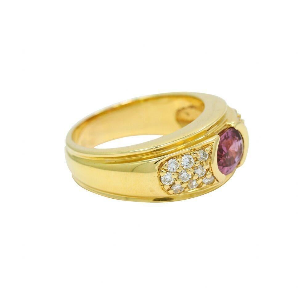 Up for sale is this 18k yellow gold pink sapphire and round diamond ring. The pink sapphire weighs 1.5ct and the eighteen (18) diamonds weigh approximately .38 carat total weight. It measures 1.00 inch in length and weighs a total of 15.6 grams. 