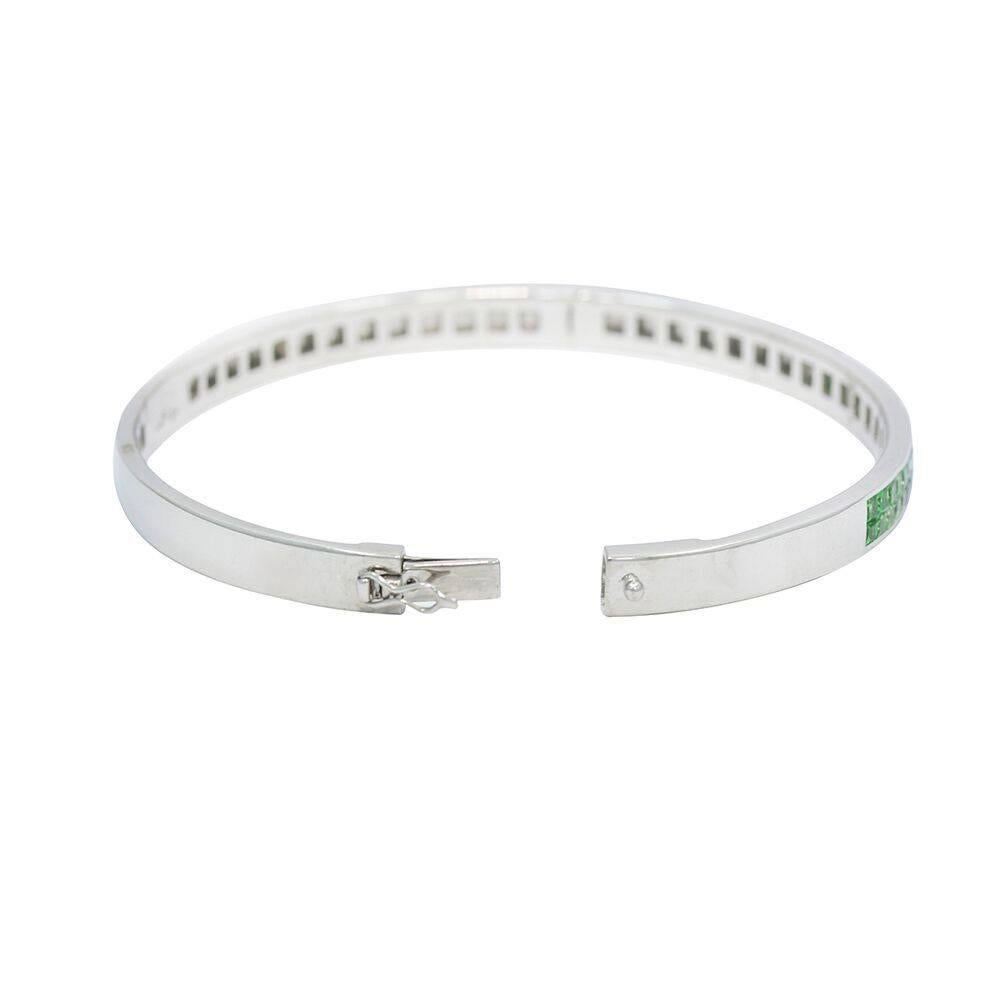 We have this 18k white gold blue and green sapphire bangle bracelet.  It measures 2.375" in height x 2.625 in width and weighs a total of 21.7 grams. The bracelet is in excellent condition. Please see all pictures and ask any questions you may
