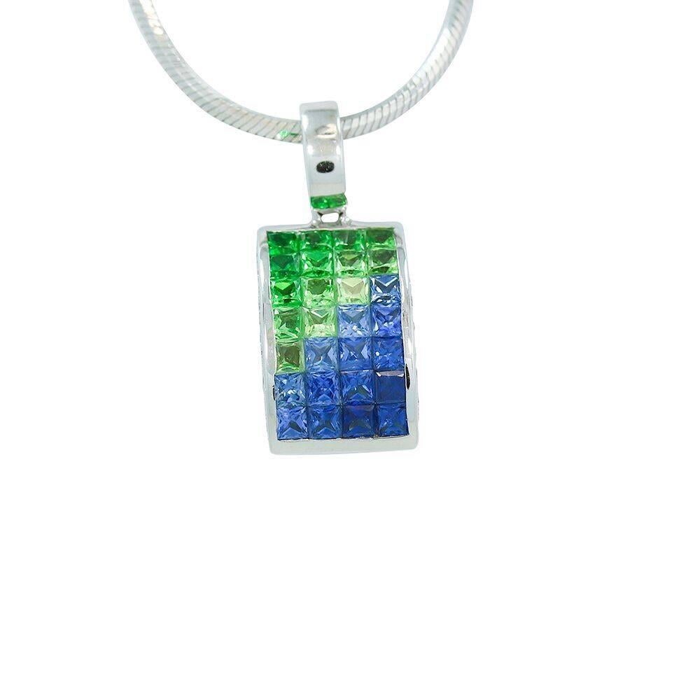 Up for sale is this beautiful 18k white gold diamond, blue and green sapphire pendant on a 14k white gold 20" snake chain. The pendant has fifty (50) diamonds weighing approximately .50 carats total weight. Chain and pendant have a total weight