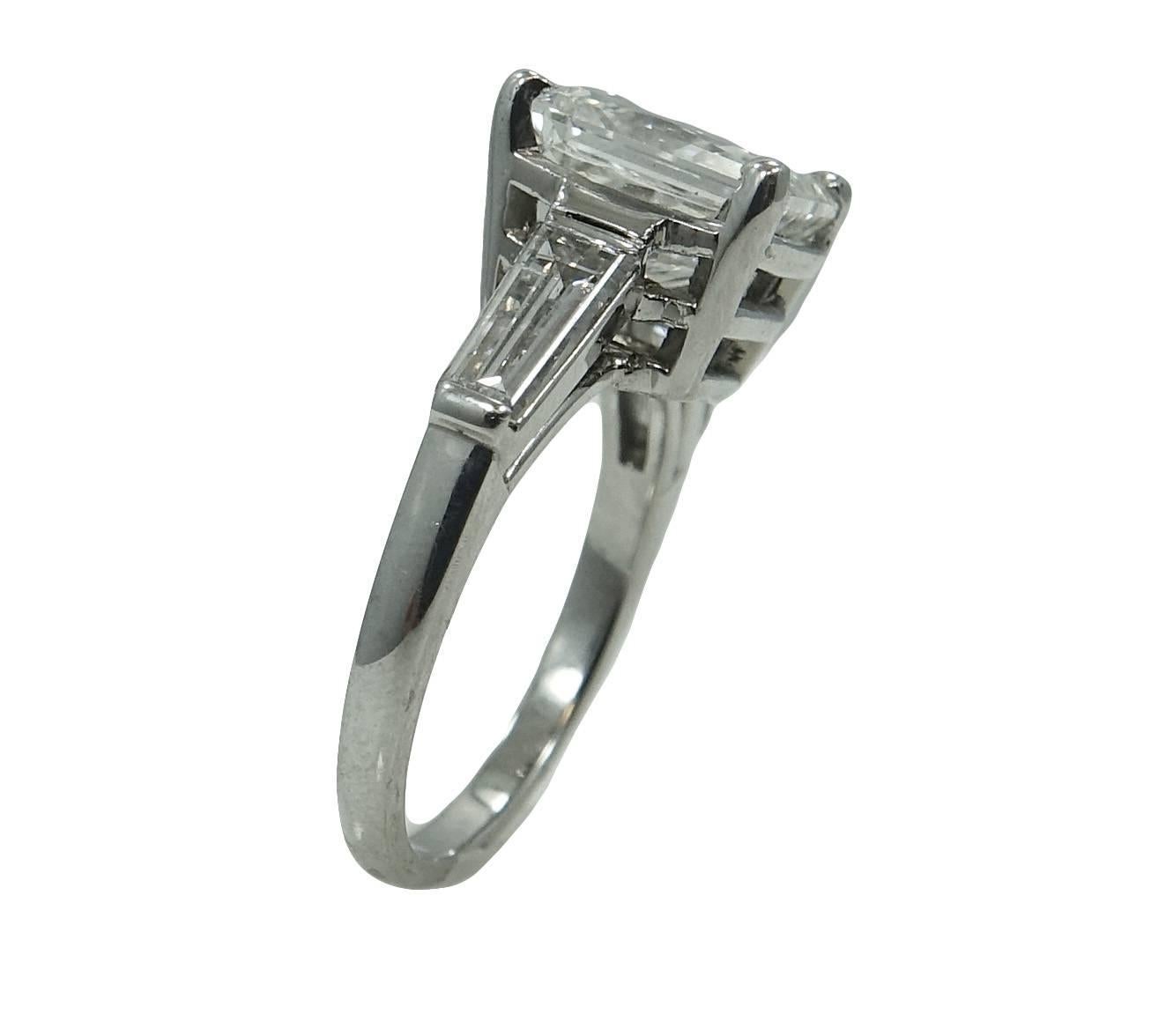 Platinum Baguette Mounting With Two Diamonds Weighing A Total Carat Weight Of .60ct With Center Modified Brilliant Cut-Cornered Rectangular Diamond Weighing A Total Carat Weight Of 4.82ct With an H Color And Si2 Clarity. GIA Report #: 5172364983.