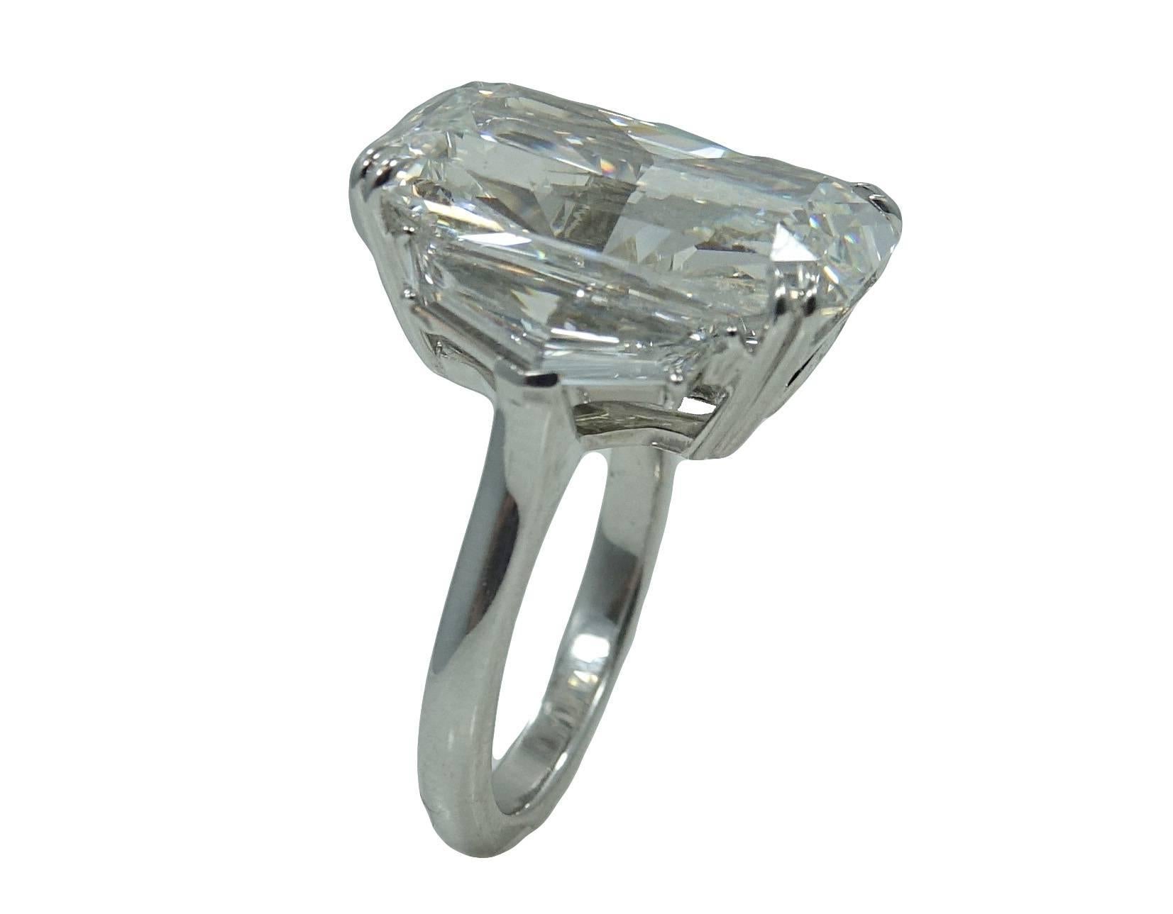 Platinum Engagement Ring With Center Enlongated Radiant Diamond Weighing A Total Carat Weight Of 15.03ct, G In Color and SI2 In Clarity (GIA Report #: 5172625179) With Two Special Long Cut Caddy Trap Diamonds Weighing A Total Carat Weight Of 1.55ct.