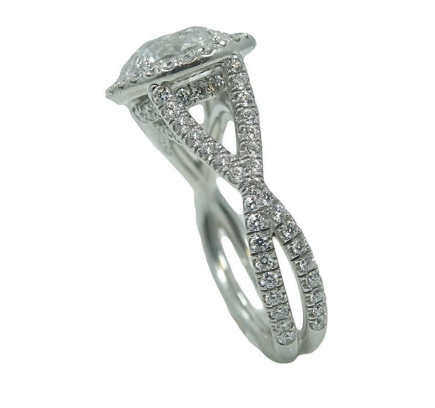 Platinum Ring With Center Round Brilliant Cut Diamond Weighing A Total Carat Weight Of 2.52ct E In Color and SI2 Clarity With Halo Top and Micro Pave Twisted Wire Shank With 126 Round Brilliant Diamonds Weighing A Total Carat Weight Of 1.06ct. This