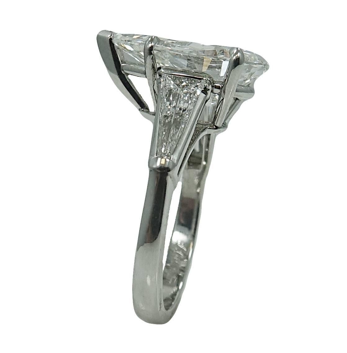 Platinum Ring With Center Pear Shape Diamond Weighing a Total Carat Weight Of 5.04ct J in COlor and VS2 Clarity (GIA Report #: 2181053087) and Two Side Baguette Diamonds Weighing a Total Carat Weight of 0.70ct H in Color and VS in Clarity. This Ring