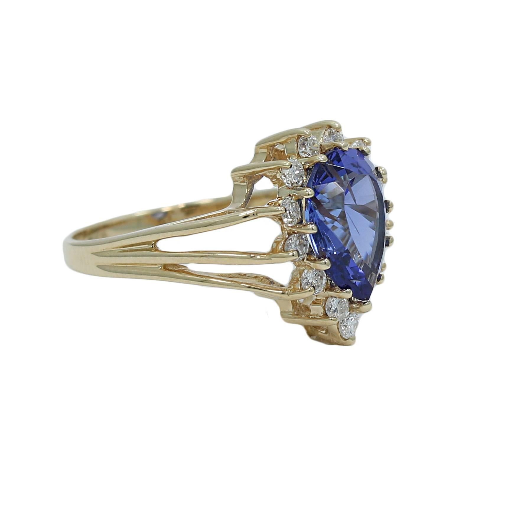 We have this 14k yellow gold pear shaped tanzanite and diamond ring. It has thirteen (13) diamonds H-I, SI-I weighing approximately .45 carats total weight and one (1) pear shaped tanzanite weighing approximately 2.00 carats. It measures 0.625"