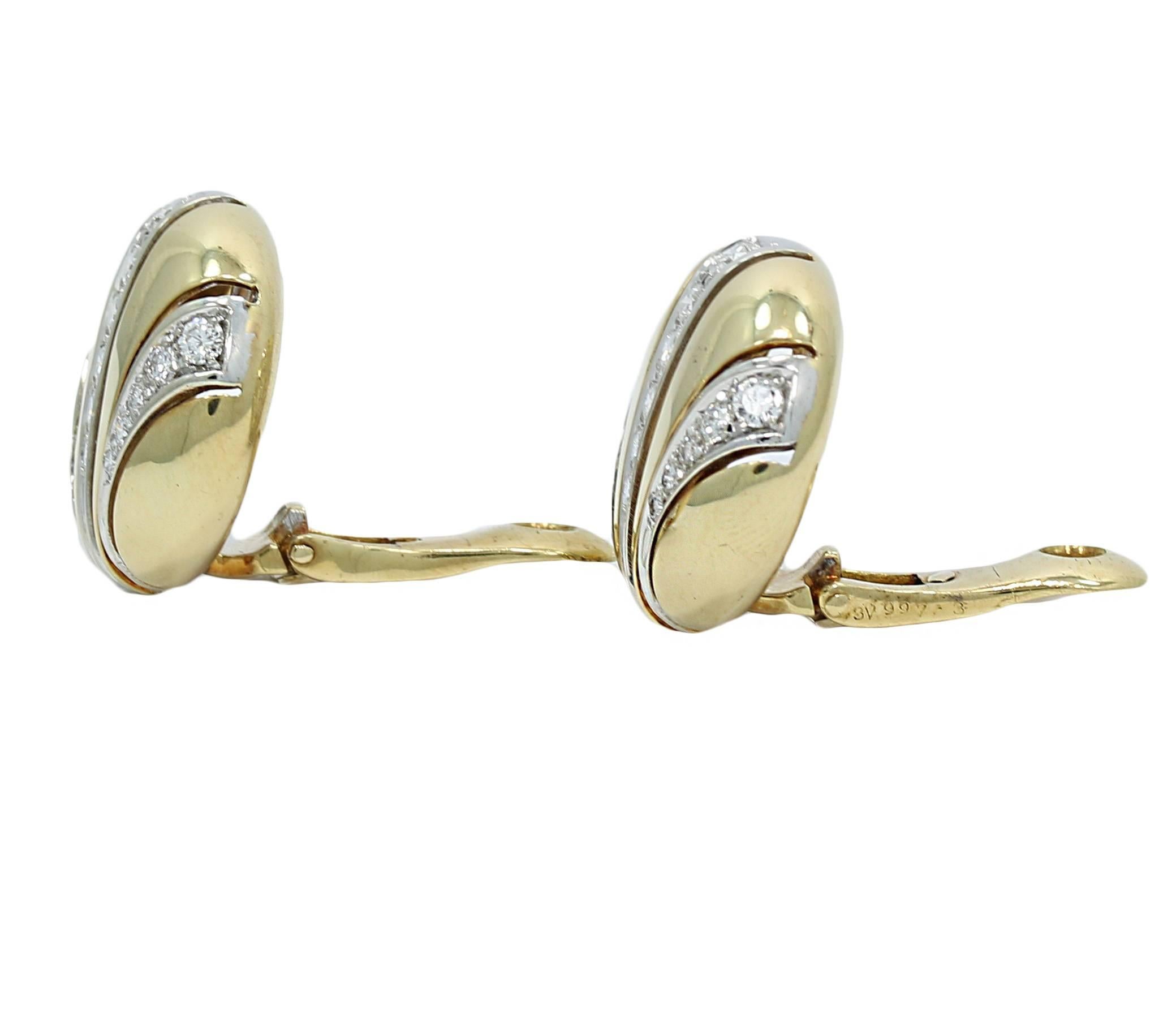 We have these Van Cleef and Arpels 18k yellow gold diamond earrings. They have thirty two (32) diamonds approximately .50 carats total weight. They measure 0.875" in height and weigh a total of 18.9 grams. They are stamped with serial number