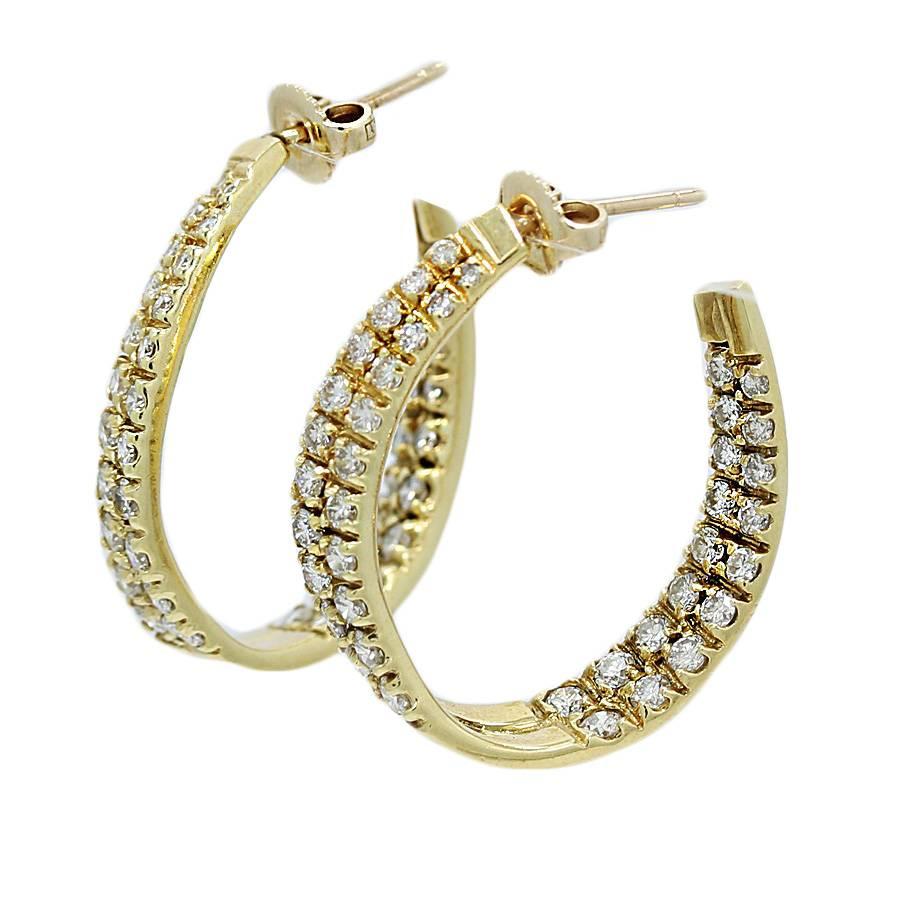 18k yellow gold "J"  Hoop Earrings. These earrings have eighty (80) diamonds weighing approximately 3.50 carats total weight and are H-I in color and VS to SI in Clarity. They measure 1.25 inches in height and weigh a total of 12.8 grams. 