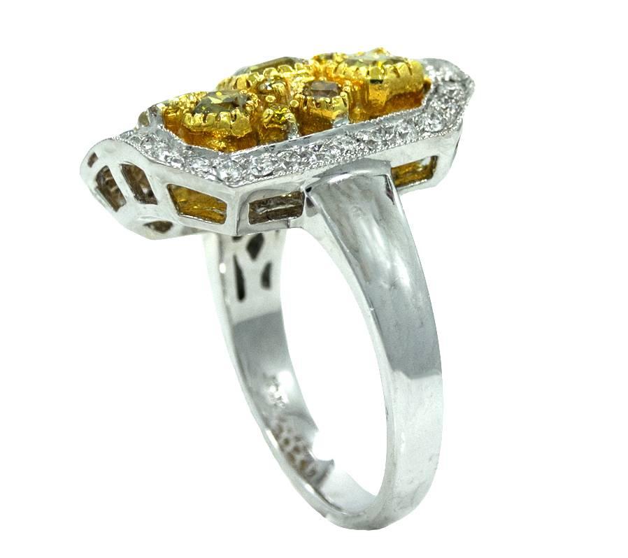 18K White Gold RIng With 7 Cushion Cut Diamonds With A Natural Fancy Color Weighing A Total Carat Weight Of 1.49ct, 9 Round Cut Yellow Diamonds Weighing A Total Carat Weight Of 0.12ct and 34 Round Diamonds Weighing A Total Carat Weight Of 0.48ct.