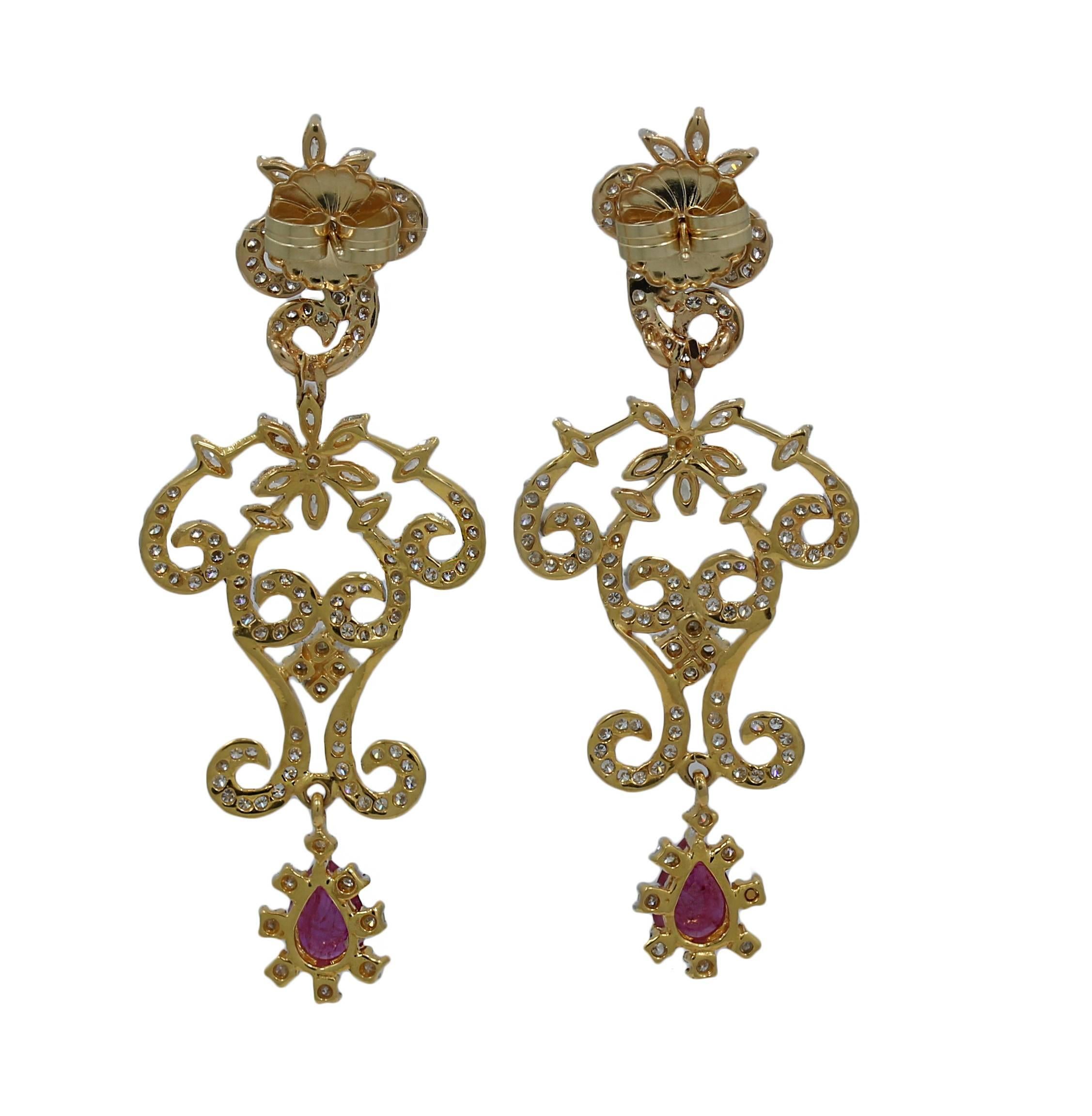 22K Yellow Gold Earrings with rubies and diamonds. Approximately 1.10 of rubies and the diamonds are approximately 2.40 carats total weight. The earrings measure 2.5 inches in length and weigh a total of 14.5 grams. The backs are 14k. 