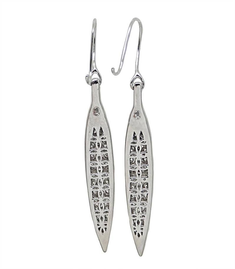 18K White Gold Leaf Shaped Dangle Earrings With Diamonds Weighing A Total Carat Weight Of 1.30 and are G/H in Color and SI in Clarity. Excellent condition. 