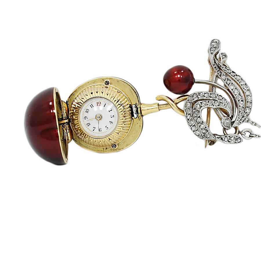18k yellow gold vintage enamel cherry pendant/pin  watch on a 22 inch platinum chain. It weighs a total of 36.9 grams. The pendant/pin is stamped with 14k and is in excellent condition. . 