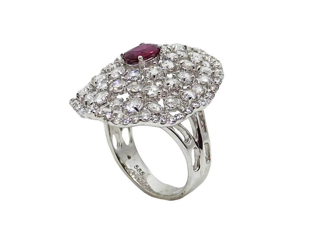 14K White Gold Ring With Diamonds Weighing A Total Carat Weight Of 2.82ct and Ceneter Burmese Ruby Weighing A Total Carat Weight Of .79ct. This Ring Is a Size 6.5.