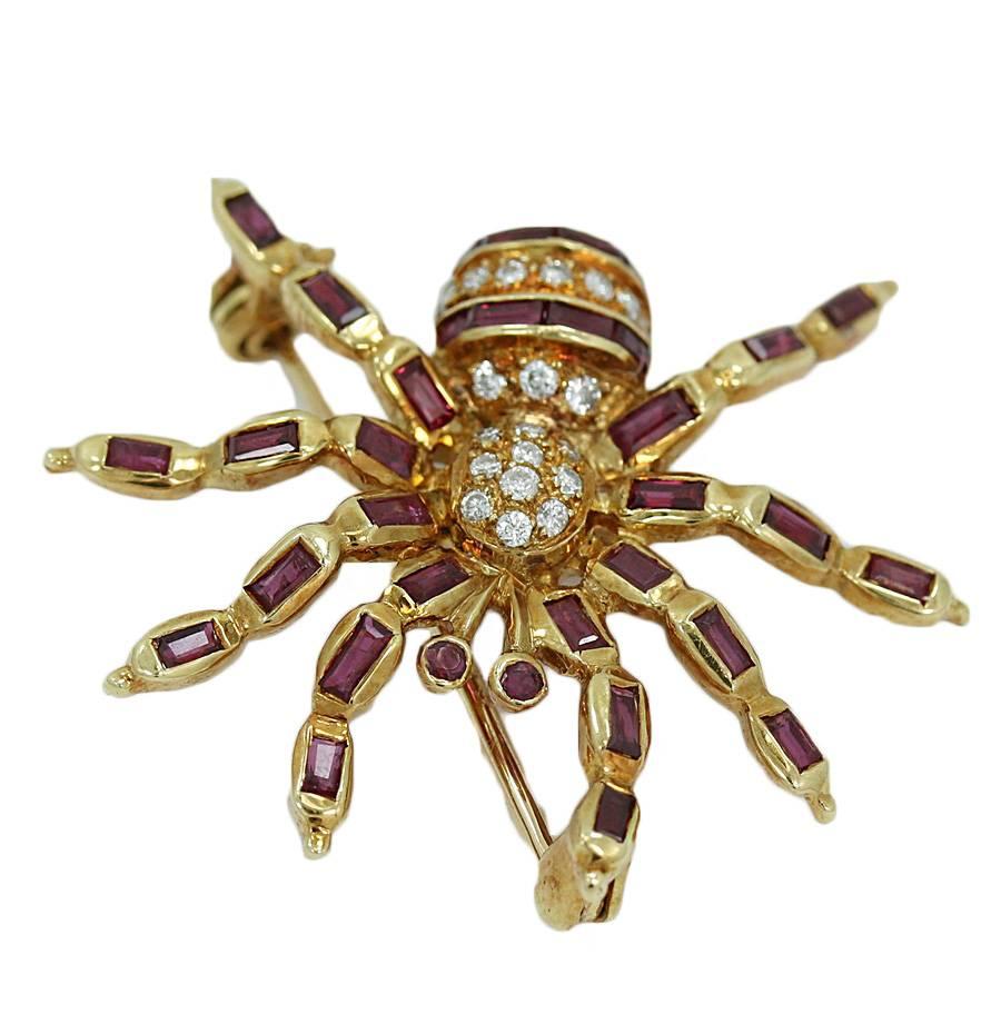 18k yellow gold spider pin with rubies and diamonds . It measures 1.00 inch in height and weighs a total of 4.3 grams. The pin is in excellent condition.