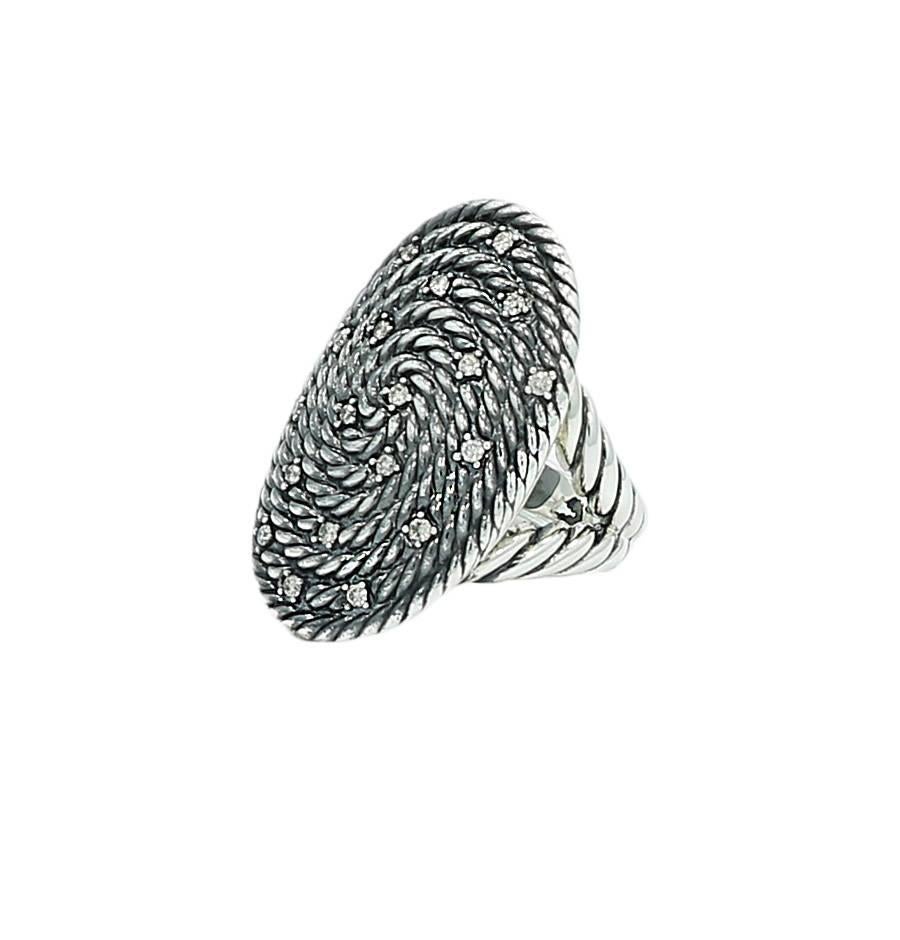 David Yurman sterling silver Cable Coil ring. It has 19 diamonds weighing approximately .38 carats total weight. It measures 1.375 inches in height and is  a size 7. The ring weighs 20.6 grams and is in excellent condition. 