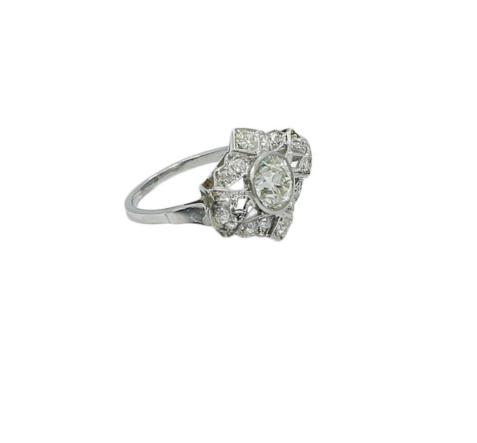 Art Deco platinum diamond ring. The diamond weighs approximately 0.95-1.00 carats total weight. The ring sits at a size 5.25 and weighs a total of 4.7 grams. The ring is in excellent condition. Please see all pictures and ask any questions you may