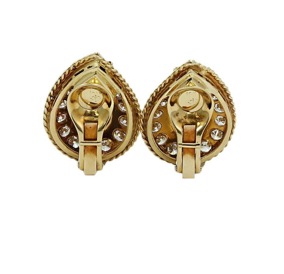 18k yellow gold diamond earrings. The diamonds weigh approximately 5.00 carats total weight. They measure 1.00 inch in height and weigh a total of 17.3 grams. The earrings are in excellent condition. Please see all pictures and ask any questions you