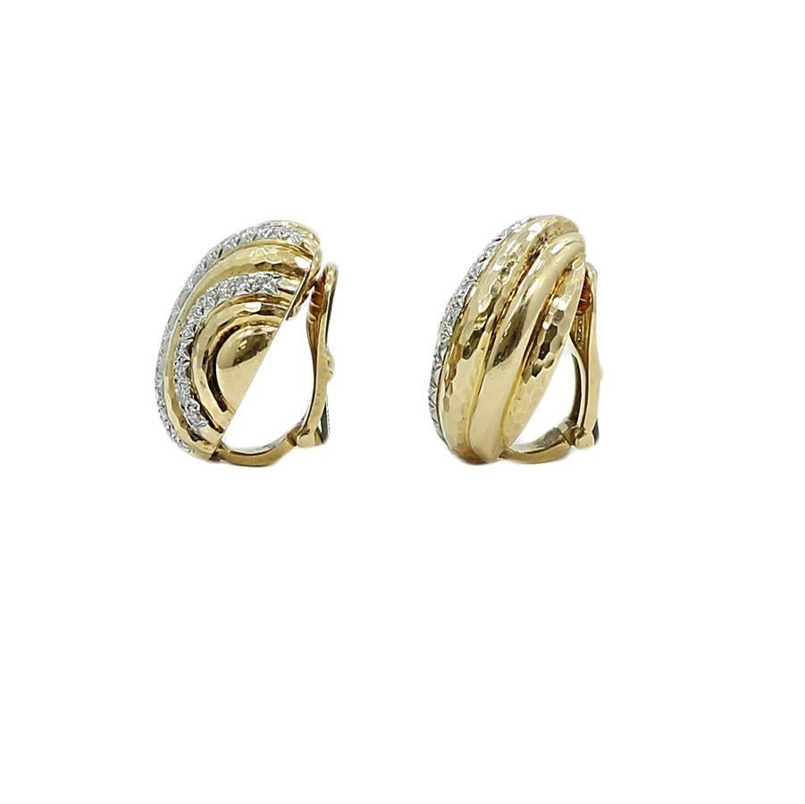 A.Clunn platinum and 18k yellow gold diamond dome earrings. The 48 diamonds G/VS weigh approximately 1.20 carats total weight. They measure 1.00 inch in height and weigh a total of 25.7 grams. The earrings are in good excellent. Please see all