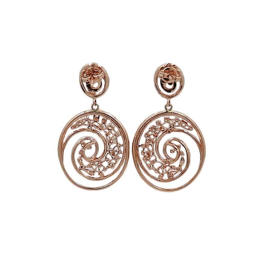 14k rose gold and diamond earrings. The 397 round diamonds H-I/VS weigh 3.89 carats total weight. They measure 1.75 inch in height and weigh a total of 13.1 grams. The earrings are in excellent condition. Please see all pictures and ask any