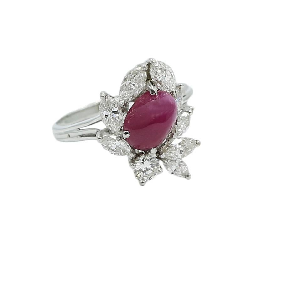 We have this platinum burma ruby and diamond ring. The ruby weighs approximately 1.00 carats total weight and the diamonds G/VS1 weigh approximately 1.00 carats total weight. The ring sits at a size 6.25 and weighs a total of 6.6 grams. The ring is