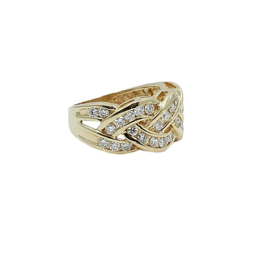 14k yellow gold and diamond braided ring. The 38 diamonds weigh approxiamtely 1.50 carats total weight. The ring sits at a size 8 and weighs a total of 7.5 grams. The ring is in excellent condition. Please see all pictures and ask any questions you