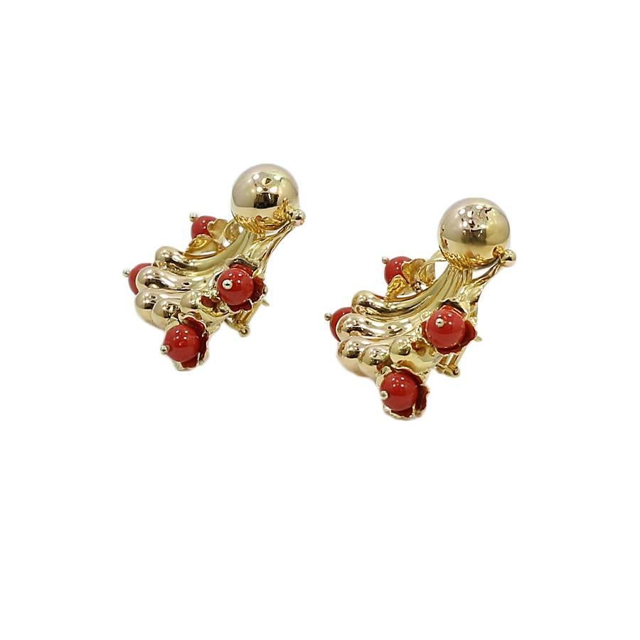 18k yellow gold and coral freeform fashion earrings. They measure 1.5 inches in height by 1.5 inches in width. They weigh a total of 34.6 grams and are in great condition. 