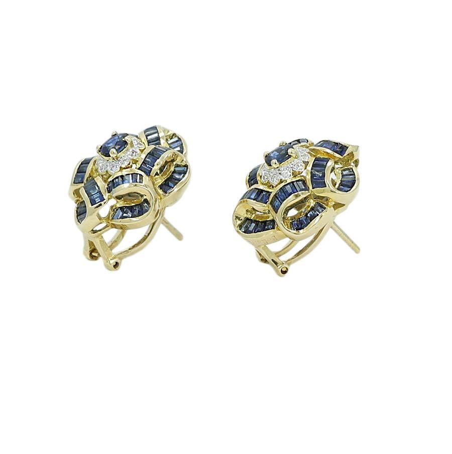 18k yellow gold diamond and sapphire Bellarri earrings. The earrings have  98 sapphires weigh approximately 4.80 carats total weight and the 20 diamonds weigh 0.20 carats total weight. They measure 0.875 inches in height and weigh a total of 14.6