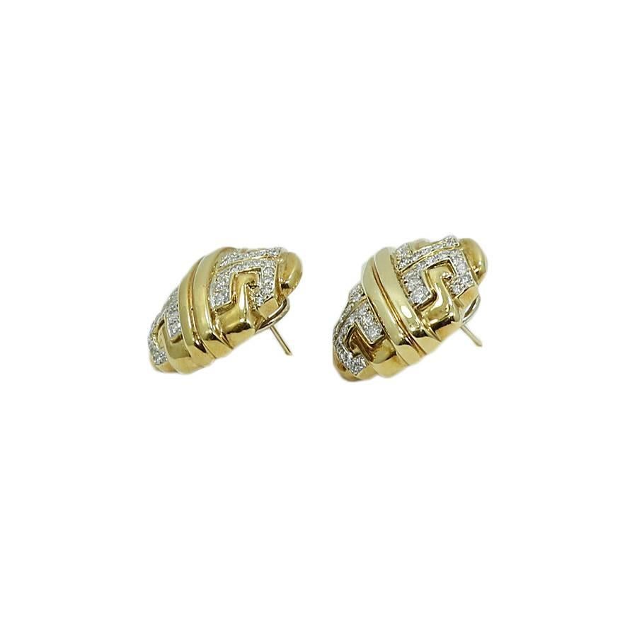 18k yellow gold button earrings. The diamonds weigh approximately 2.40 carats total weight. They measure 1.00 inch in height by 1.00 inch in width with a total weight of 24.8 grams. The earrings are in good condition. Please see all pictures and ask