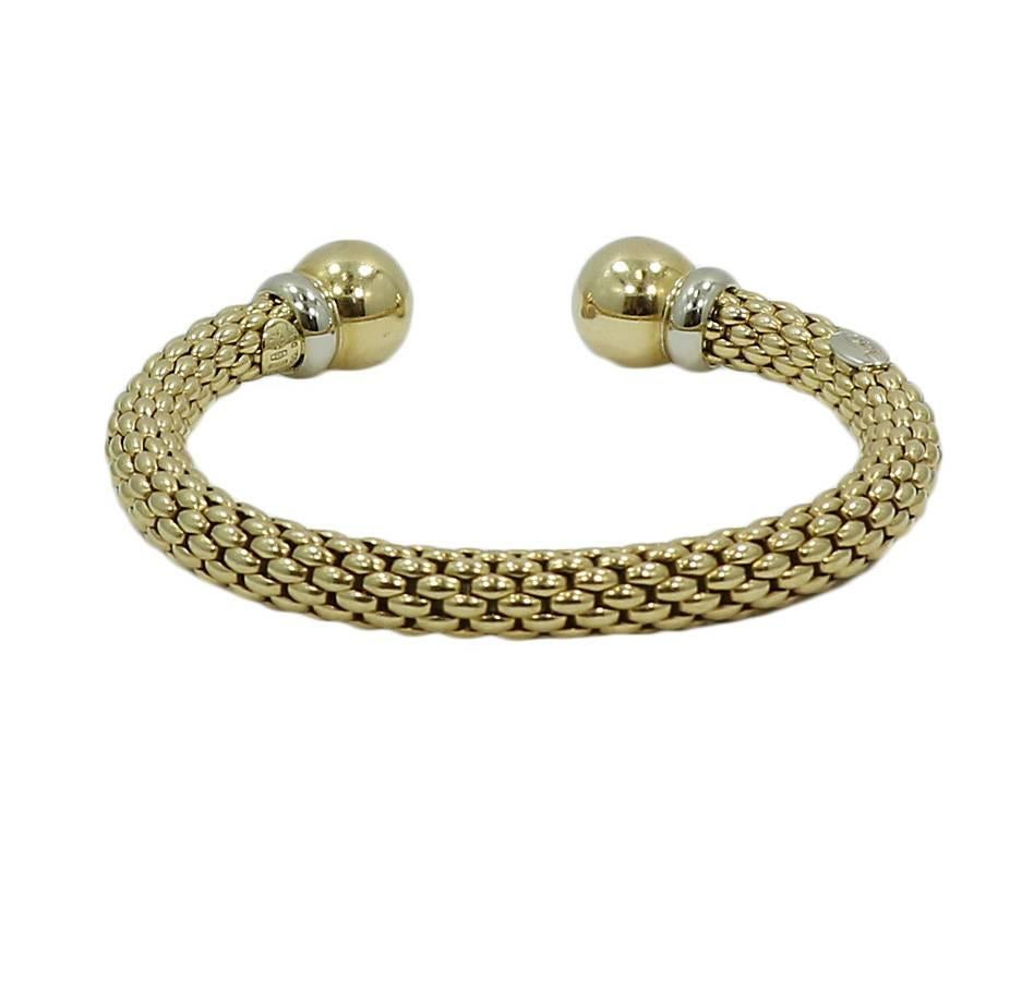 FOPE 18k white and yellow gold bracelet/bangle. The bracelet measure 2.75 inches in width and weighs a total of 37.1 grams. The bracelet is in excellent condition. 