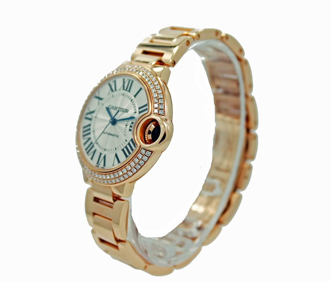 Estate Catier Ballon Bleu Watch. 33mm pink gold case with round brilliant diamonds on bezel=1.04ct's total weigh, G Color and VVS2  Clarity. This beautiful watch also has a 18K pink gold bracelet, a blue sapphire cabochon on the crown and a