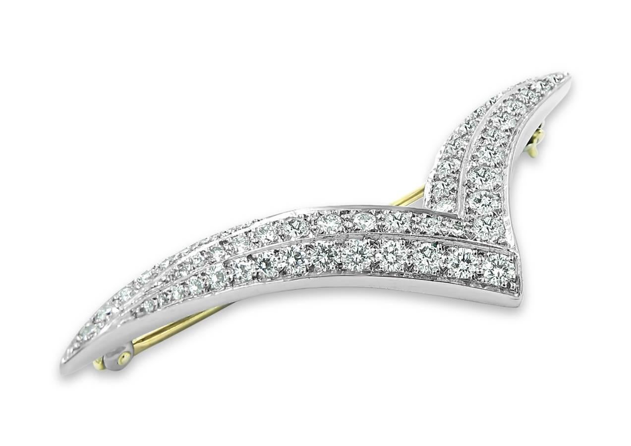 Tiffany & Co. Platinum and Diamond brooch holds 54 round brilliant diamonds of high quality and equal approximately 1.50cts in total weight all prong set securely in platinum. Needle point is made of 18k yellow gold.