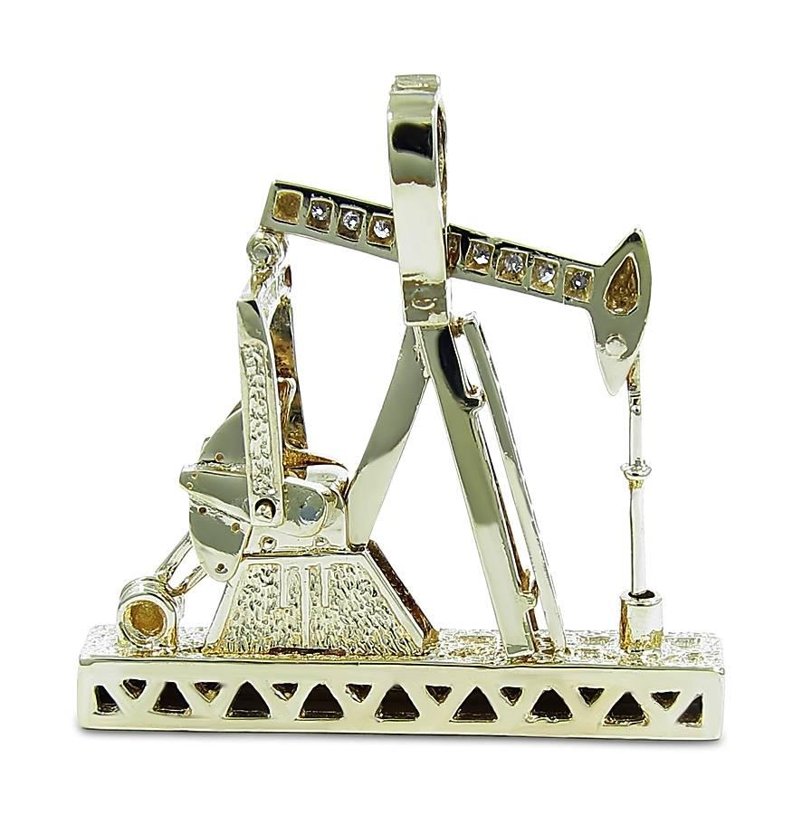 This neat diamond and gold pump jack is made of solid 14k yellow gold. The rod, bridle, horse head, walking beam, pitman arm, counter weight and crank move slightly up and down to give it a realistic feature. There are 42 round brilliant cut