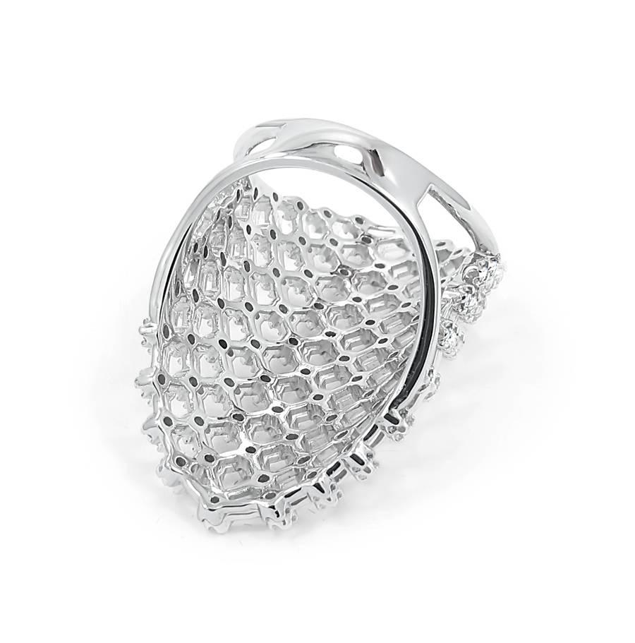 14k white gold ladies oval shaped checkered style ring with full bezel set round diamonds equaling .70ctw with quality of F-G in color and SI-VS in clarity.